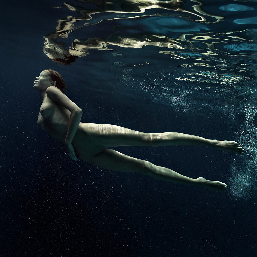 Naked man underwater by ed freeman